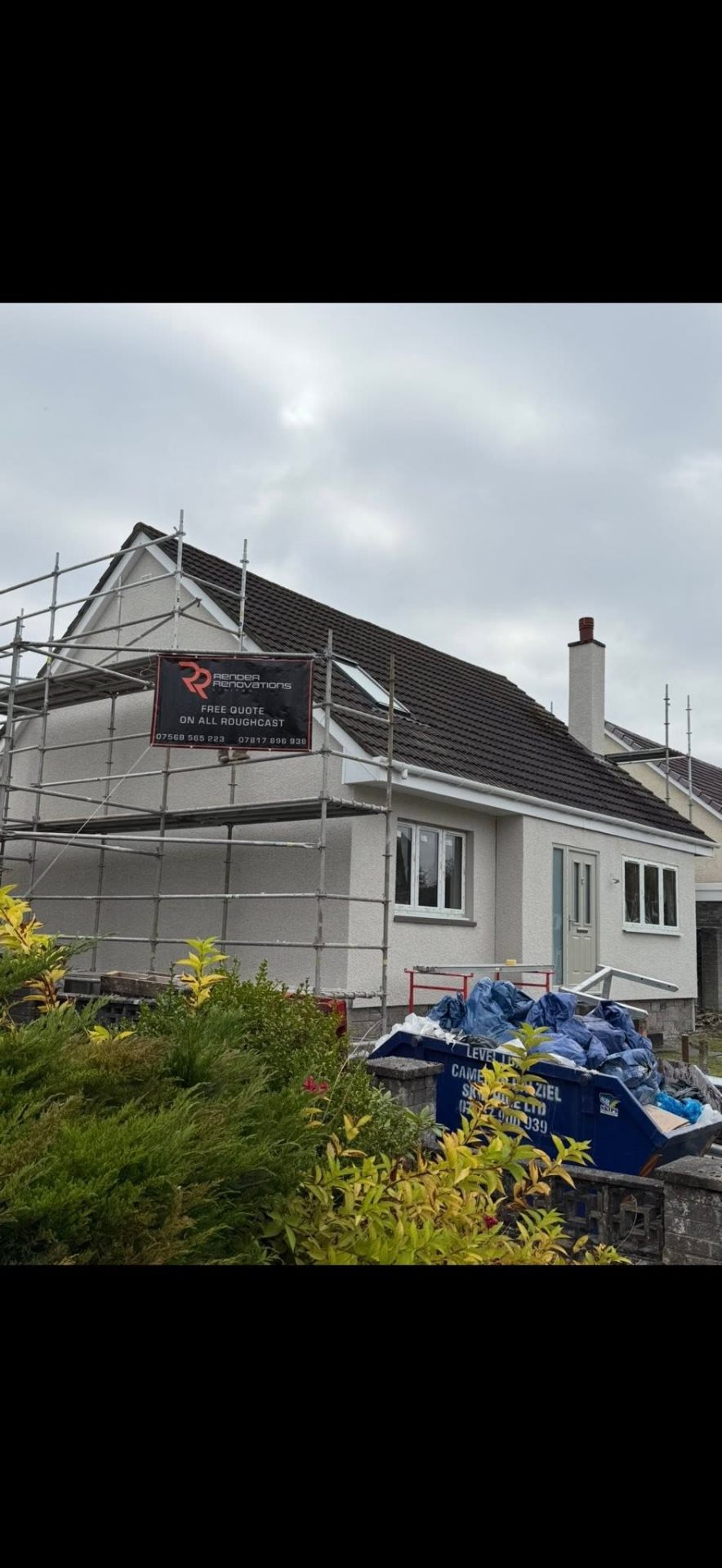 Render Renovations branded banner on scaffold at a completed roughcast job